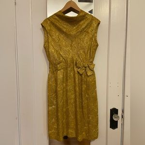 Gold sparkly vintage, just above the knee, bow at waist
